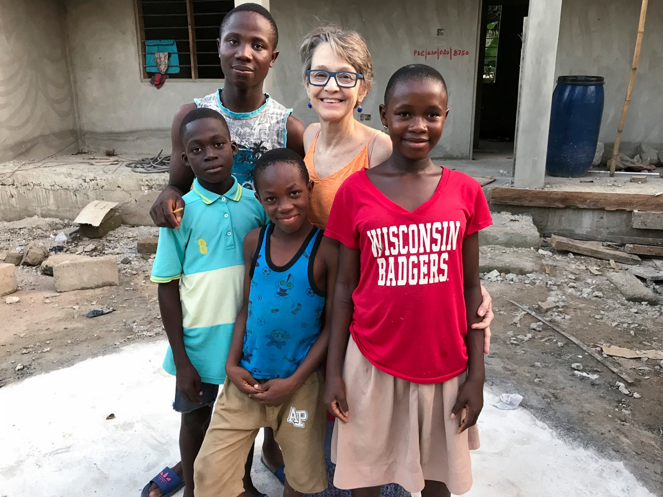 Geri Johnson with local children in Mafe Kumase